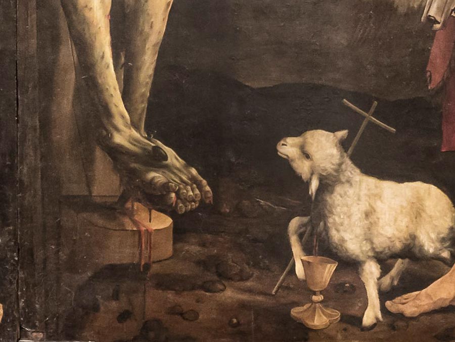 Ausschnitt aus dem Altarbild des Isenheimer Altars<br>Bild: Wikimedia Commons Der Ausschnitt aus dem Tafelbild vom Isenheimar Altar zeigt die angenagelten Füße des Gekreuzigten und eine Darstellung des geopferten Lammes.